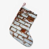 Oude  bakstenen wand met gestrooid wit gipsplaat kleine kerstsok (Voorkant (Hangend))