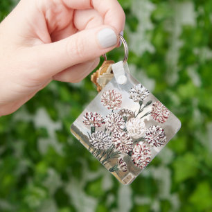 Oude bonte anjerbloemen met grijze lucht sleutelhanger