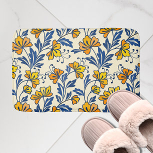 Oude gele oranje volksbloem in blauw blad badmat