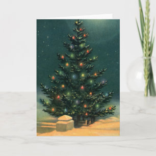 Oude kerstboom 's nachts met lichten en sneeuw feestdagen kaart