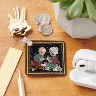 Oude kinderen die een denkbeeldig theepartijtje he sleutelhanger