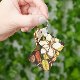Oude magnoliabloemen plant met zaden sleutelhanger