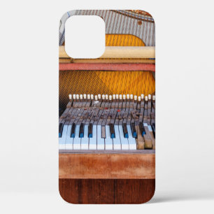 Oude piano met het deksel eraf. Een vervallen iPhone 12 Hoesje