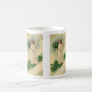 Oude victoriaanse paasengel met bloemen koffiemok