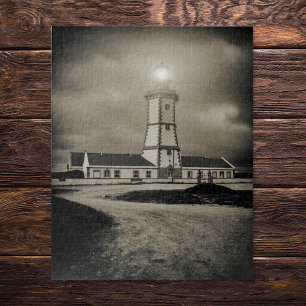 Oude vuurtoren op een storm nacht legpuzzel