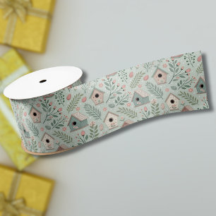 Ouderwetse pastel vogelhuisjes met bloeiende bloem lint