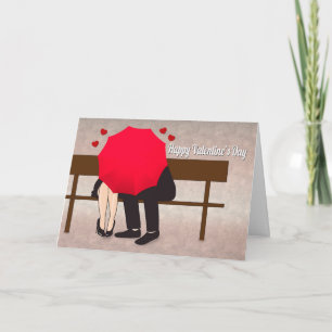 Paar achter een rode paraplu voor Valentijns Kaart