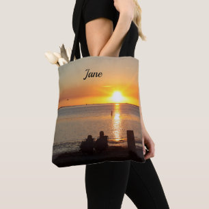 Paar zit op strand op de Canvas tas