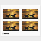 Paarden die op zonsondergang Stickers lopen (Vel)