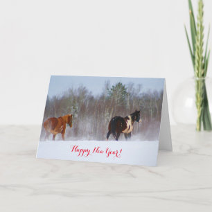 Paarden in de kaart van het sneeuwNieuwjaar