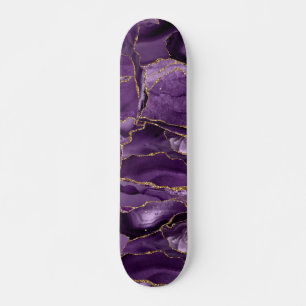 Paars en goudglitteraglaat skateboard