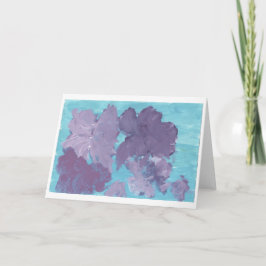 Paarse bloemen op blauwe achtergrond notitiekaart