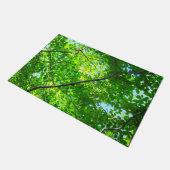 Paillasson Canopée verte, Branches feuillues avec ciel bleu (Incliné)