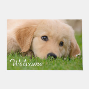Paillasson Le chiot mignon de golden retriever rêve l'accuei