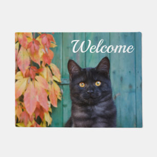 Paillasson Le rouge mignon de chaton de chat noir laisse