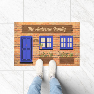 Paillasson Maison en brique avec porte bleue Texte personnali