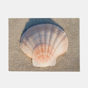 Paillasson Mer Shell s'étendant sur la plage sablonneuse
