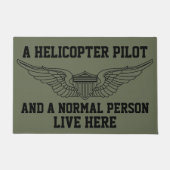 Paillasson Un pilote d'hélicoptère et une personne normale vi (Devant)