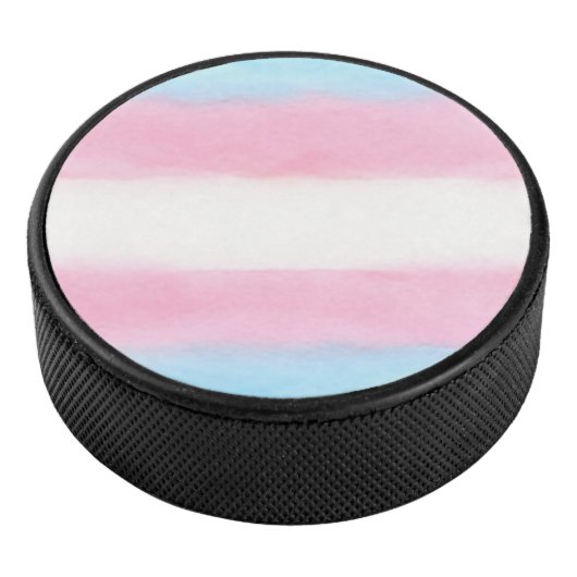 pale trans flag design on hockey puck (3/4)
