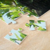 Panda rouge dans un puzzle d'arbre (Côté)