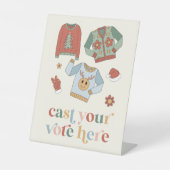 Panneau de vote du concours de pull moche de Noël  (Recto)