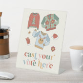 Panneau de vote du concours de pull moche de Noël  (In SItu)