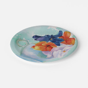 PANSIES IN EEN BORD VAN HET PAPIER VAN DE TEACUP