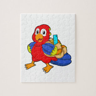 Papegaai als leerling met rugzak legpuzzel