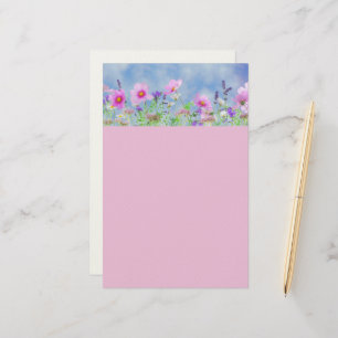 Papeterie rose et bleue avec garniture florale