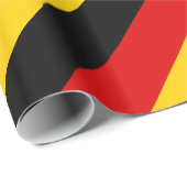 Papier Cadeau Allemagne : bandes dorées rouges noirs (Coin rond)