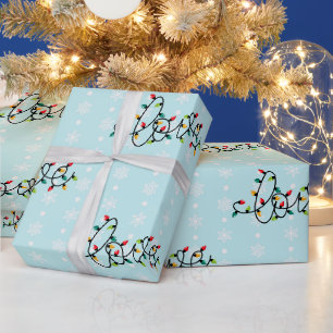 Papier Cadeau « Amour » dans des lumières de Noël, flocons de ne