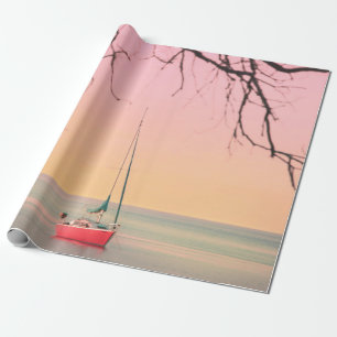 PAPIER CADEAU BATEAU ROUGE SUR LA PLAGE PENDANT LE COUCHER DE SO
