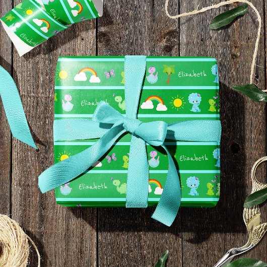 Papier Cadeau Bébé Dinosaures avec papillons, arc-en-ciel et sol