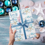 Papier Cadeau Côte Tropical Joyeuses Fêtes de Noël<br><div class="desc">Enveloppez vos cadeaux de Noël dans une ambiance tropicale et côtière avec SEAS & GREETINGS dans un élégant script de calligraphie typographie design accentué avec l'étoile de mer dans des couleurs bleu aqua turquoise sur un arrière - plan blanc éditable. ASSISTANCE : Contactez le concepteur via Zazzle Conversation ou makeitaboutyoustore@gmail.com...</div>