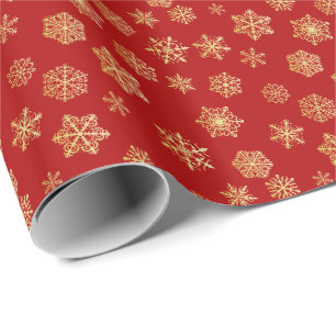 Papier Cadeau Des flocons dorés sur un arrière - plan rouge