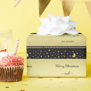 Papier Cadeau Etoiles de Noël brillantes or, pattes sur or et no