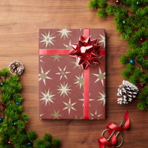 Papier Cadeau Etoiles de Noël Gold Geo - sur motif rouge.