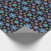 Flocons de neige colorés sur fond noir Noël