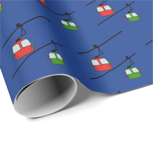 Papier Cadeau Gondolas verts et rouges avec skis sur bleu (Coin rond)