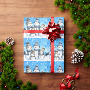 Papier Cadeau Jolie famille des bonhomme de neige dans la neige