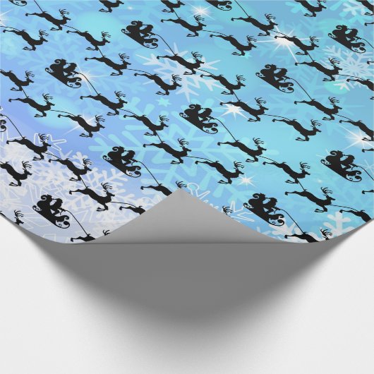 Papier Cadeau Le Père Noël et son renne volant Noël (Coin)