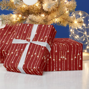 Papier Cadeau Lumières Étincelantes En Or De Noël Sur Rouge