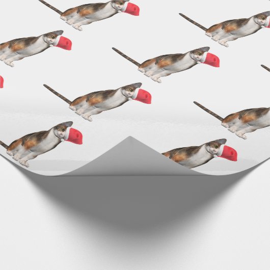 Papier Cadeau Meowy Noël avec un chat ludique dans un casquette (Coin)