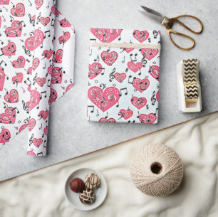 Papier cadeau musical noir et cœurs rouges