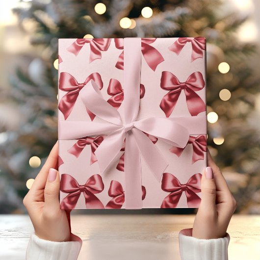 Papier Cadeau Noël Bow rouge sur Arrière - plan rose