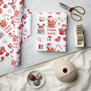 Papier Cadeau Nom enfant migre vers du Motif Père Noël