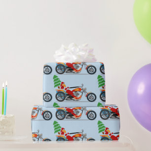 Papier Cadeau Père Noël moto sur un hélico portant un arbre d