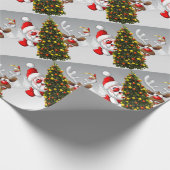 Papier Cadeau Santa claus and reindeer behind a christmas tree.j (Coin)