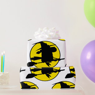 Papier Cadeau Silhouette de sorcière volant sur un balai contre