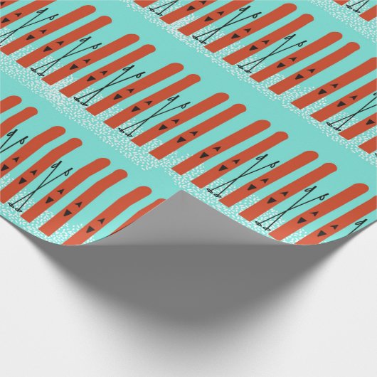 PAPIER CADEAU SKIS ROUGE AVEC NEIGE SUR PAPIER EN WRAPPER BLEU (Coin)